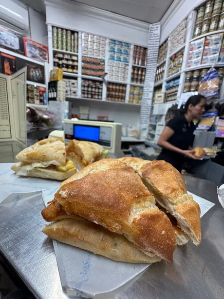 Fresh bocadillo at a traditional Seville deli shop