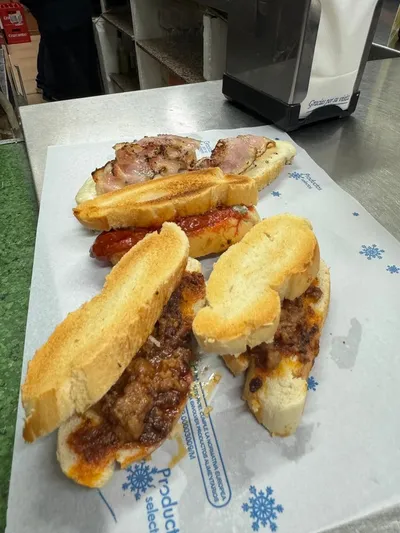 Traditional montaditos de pringa and chorizo in Seville